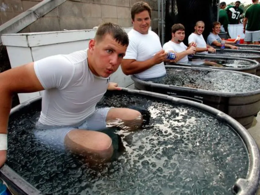 Athlete recovering in inflatable cold plunge pool