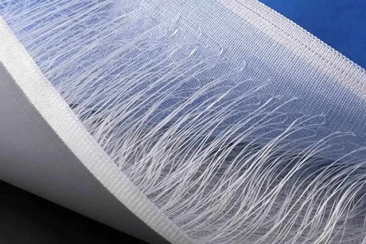 Internal structure of drop stitch material showing thousands of polyester connecting threads between two PVC base fabric layers